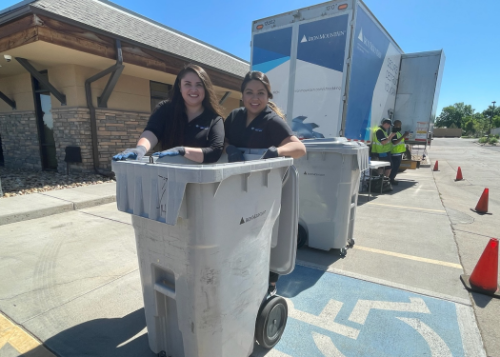 Staff with dumpsters and shred truck
